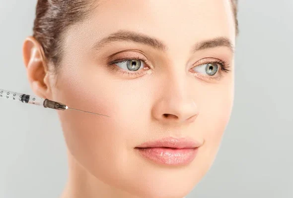 depositphotos_270576716-stock-photo-close-syringe-face-attractive-woman